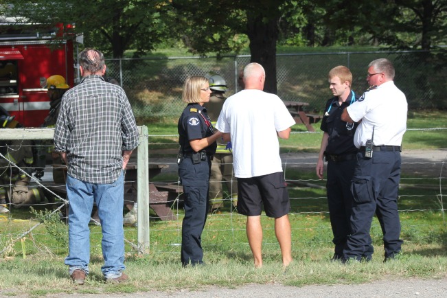 Fire Chief Dan Skaros consults with EMS crew