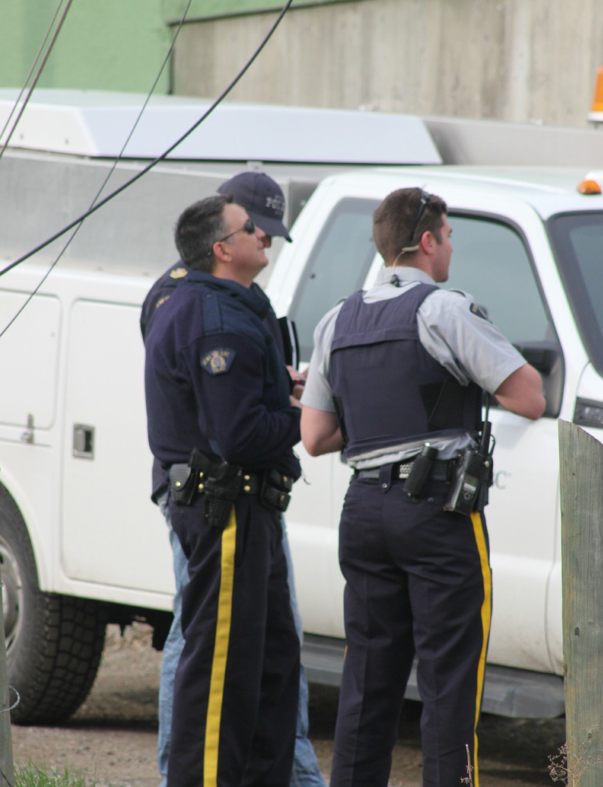 RCMP officers on scene behind Desert Arms Hotel Monday