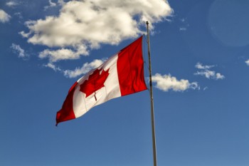 http://www.dreamstime.com/stock-photography-canadian-flag-blue-sky-background-clouds-image39899742