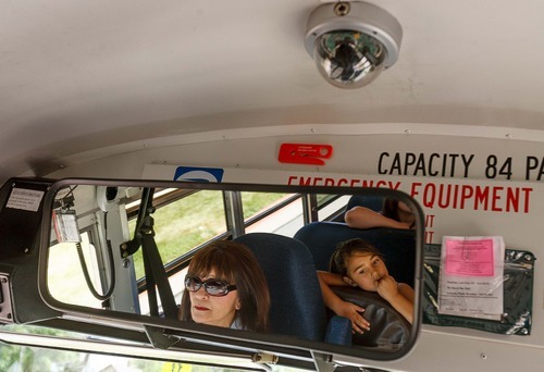 Trent Nelson | The Salt Lake Tribune School bus driver Sylvia Wouters drives students from Pleasant Green Elementary School Friday, June 15, 2012 in Magna, Utah. Granite School District has installed video cameras on school buses.