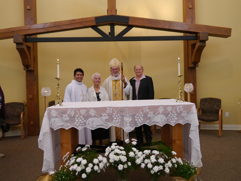 Fr Neil Lustado, Doreen Steger, Bishop John Corriveau, Frank Steger at the new, ready to go, altar.