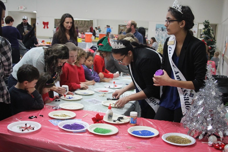 Oliver Ambassadors visit with an excited group of kids.